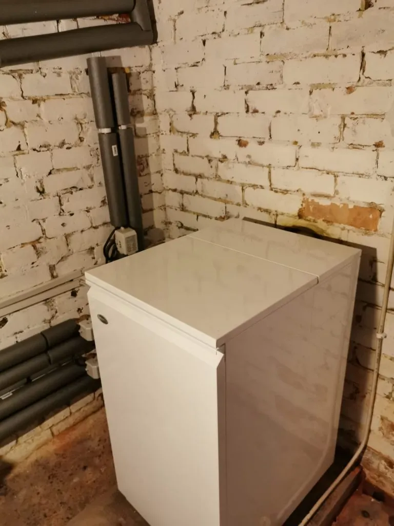 An oil boiler in an outhouse.