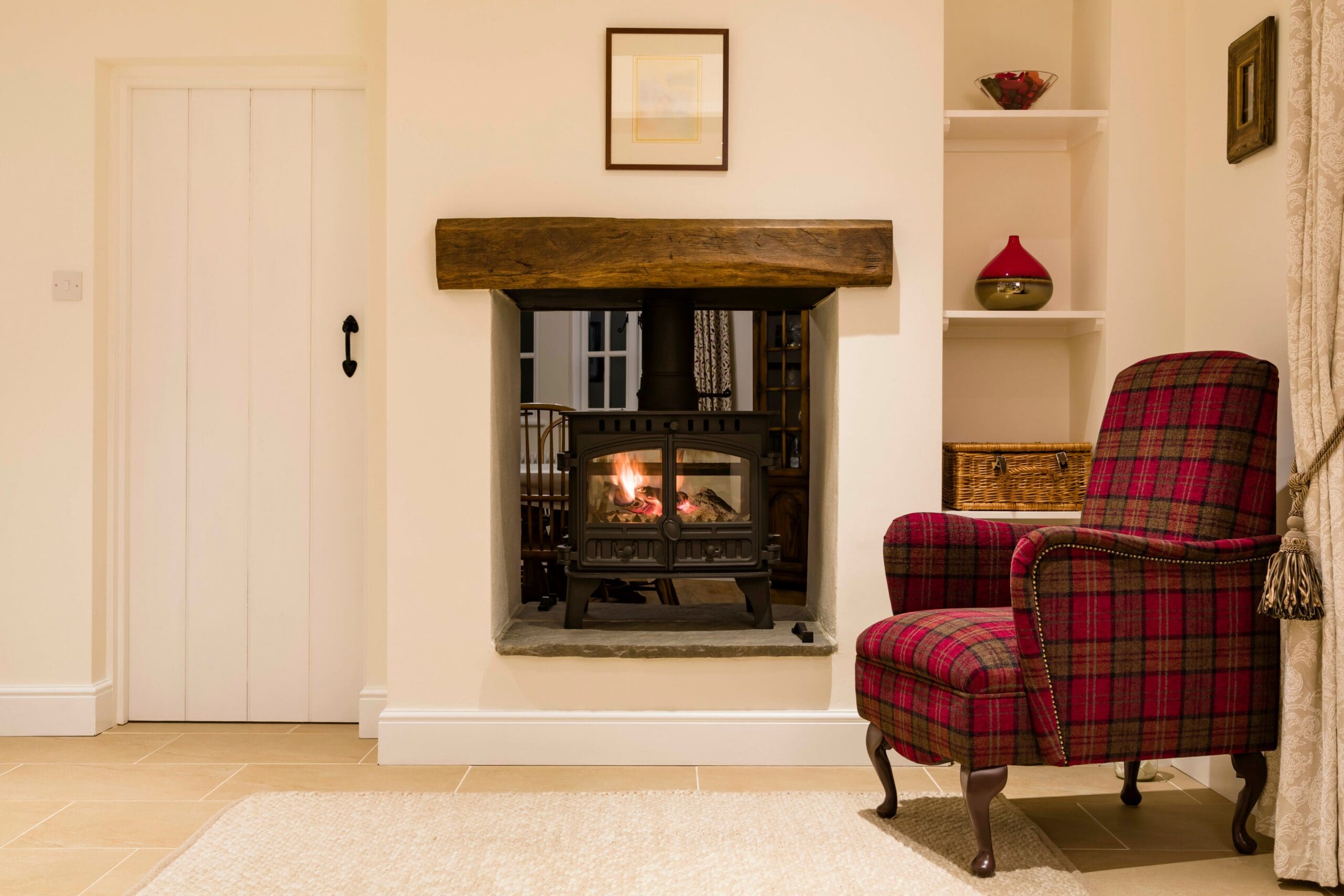 Wood burning stove in a chimney breast in a traditional home